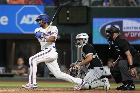 Heaney strikes out 11, Garver and Garcia homer as Rangers beat White Sox 2-0 in less than 2 hours